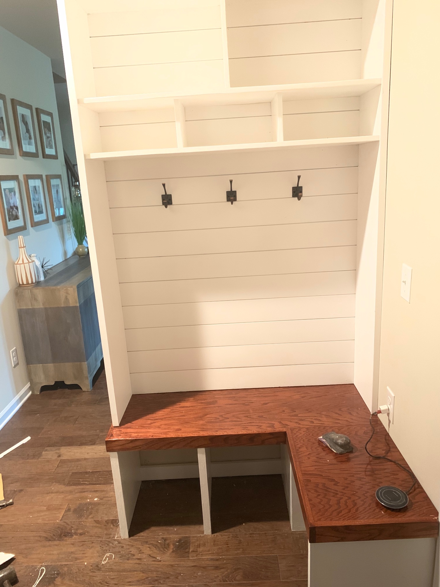 Shiplap drop zone with corner bench, upper cubbies and stained oak top