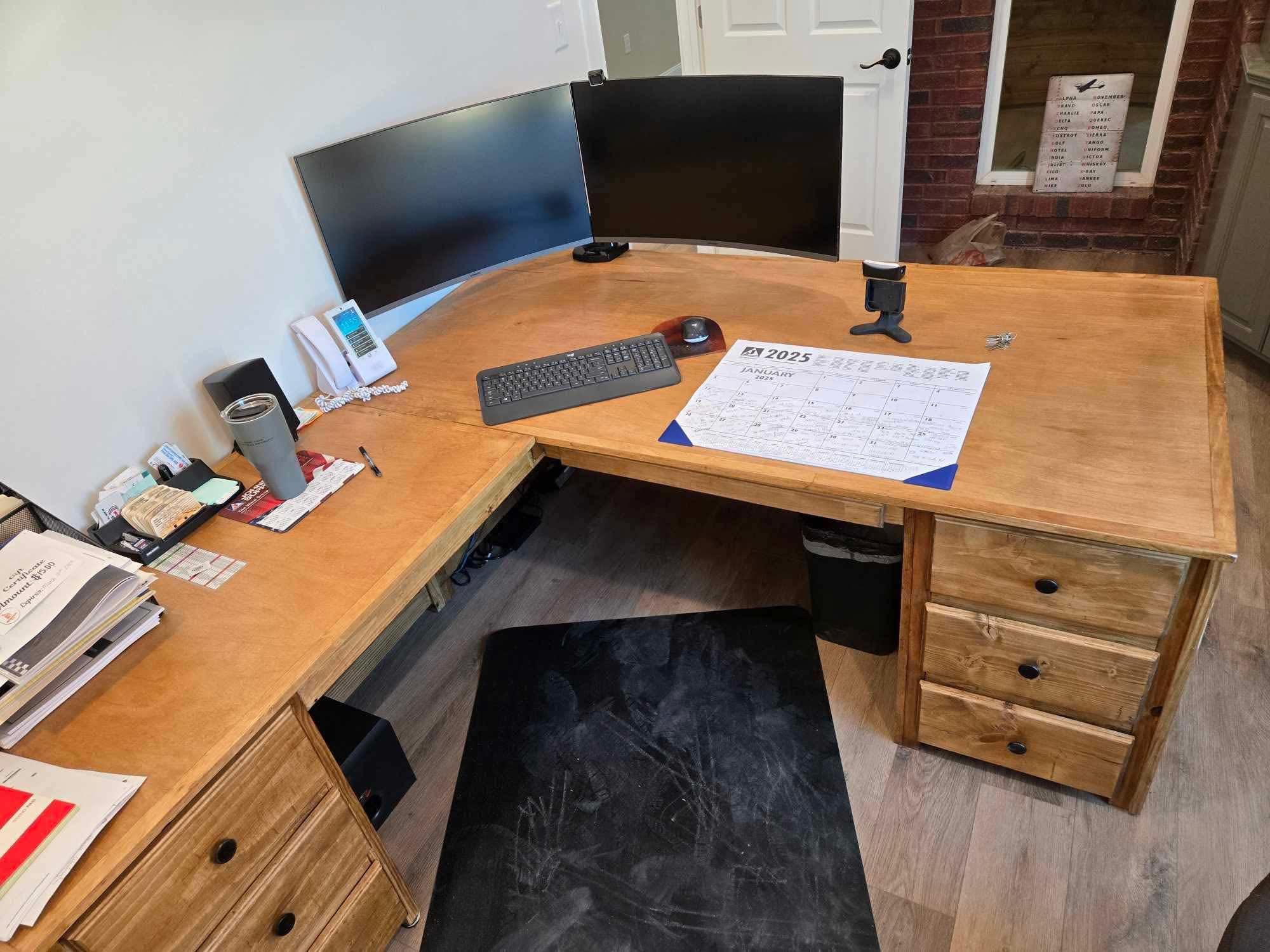 Large custom L-shaped wood home office desk with drawers and curved front edge