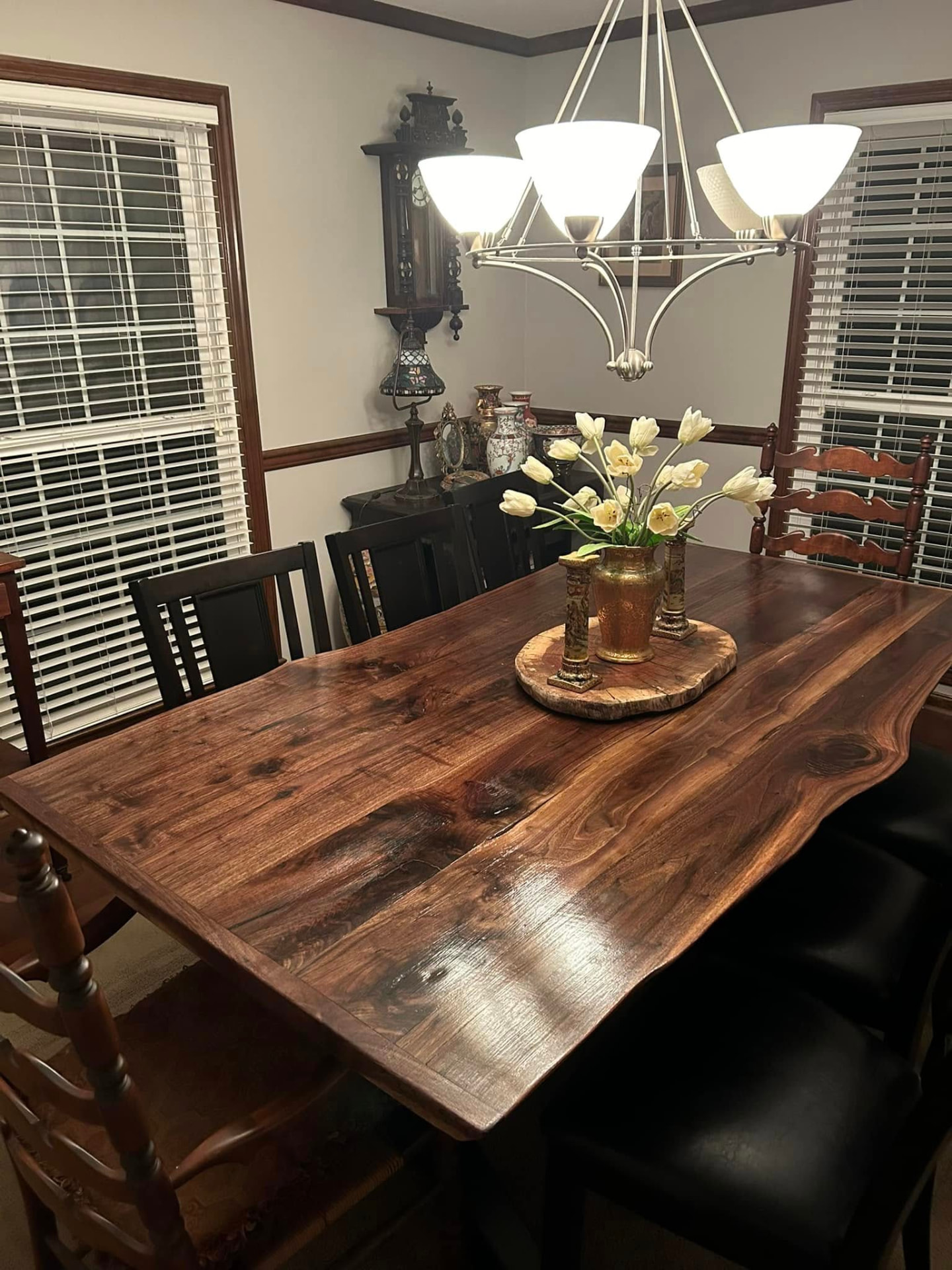Live-edge walnut dining table with natural grain in a dining room